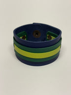 Brazalete de cuero artesanal azul y verde hecho a mano en Barcelona – Mangel Delferri